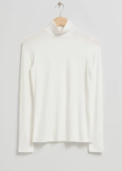 Topp Med Turtleneck