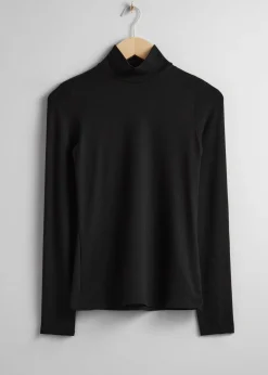 Topp Med Turtleneck